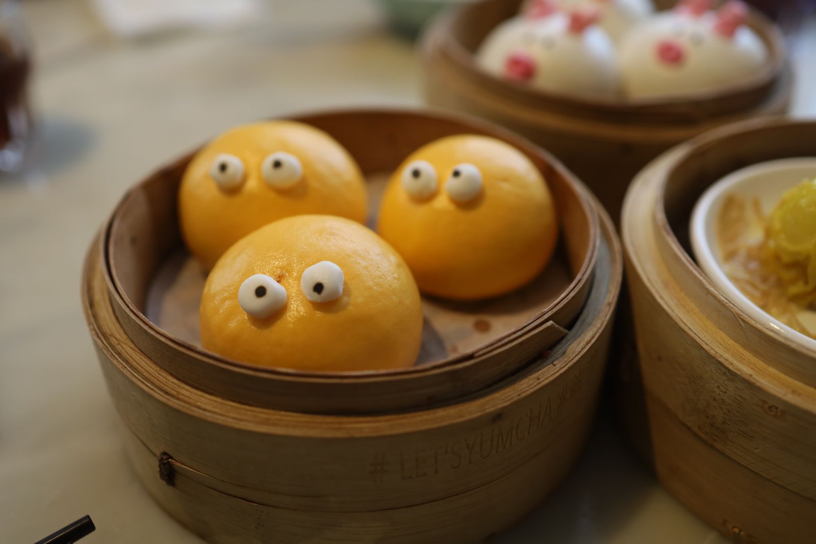 The cute appearancee of Hot Custard Molten Bun (睇住流奶), with salted duck egg and custard inside.
