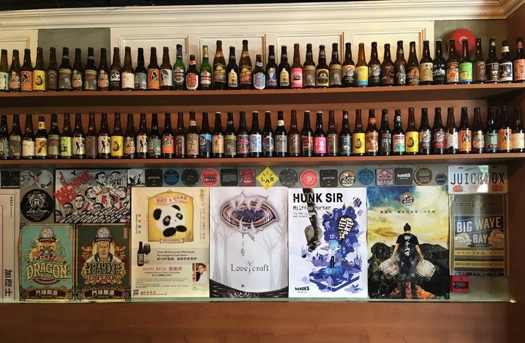 Beer bottles and posters wall