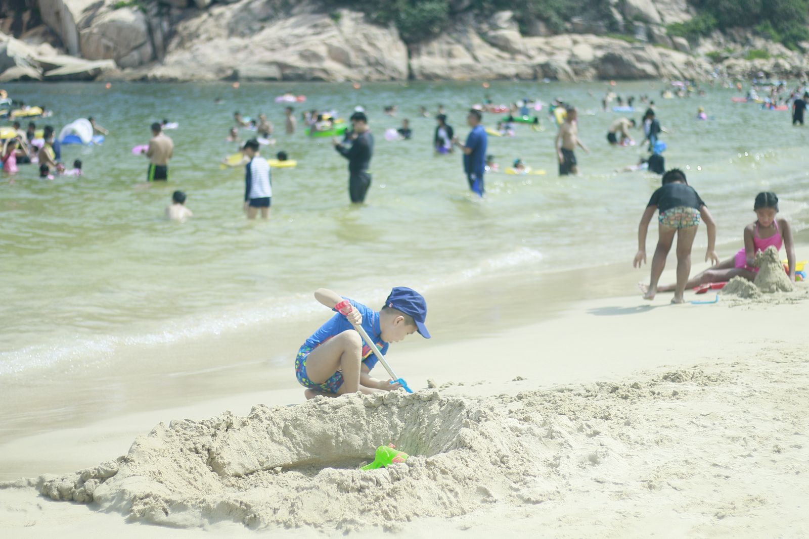 The kids enjoy playing with the sand