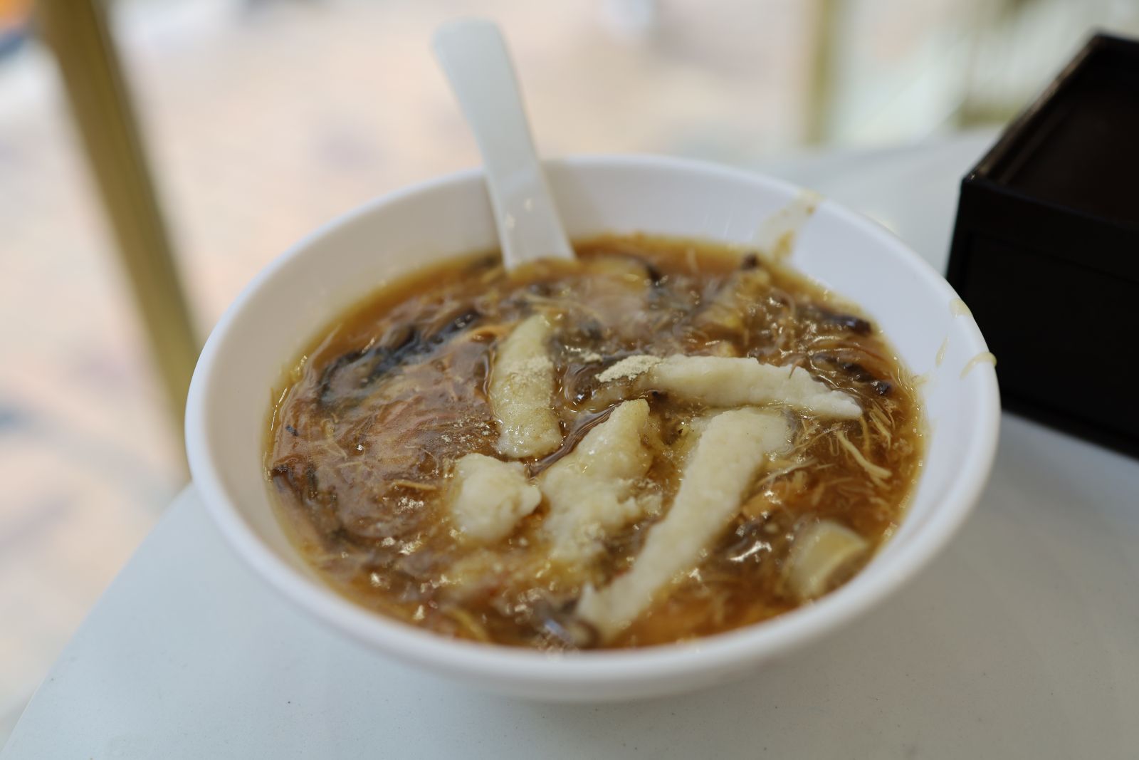 Homemade minced fish meat is added to the Imitation Shark Fin Soup, and the mixture - Leung Kau 