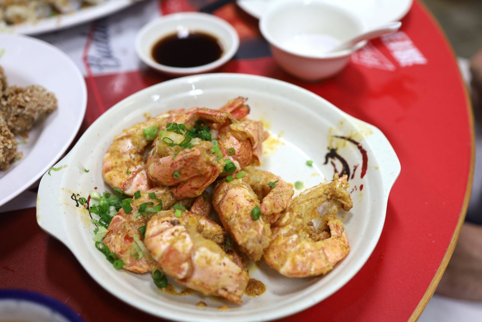 Fried shrimps coated in salted egg yolk