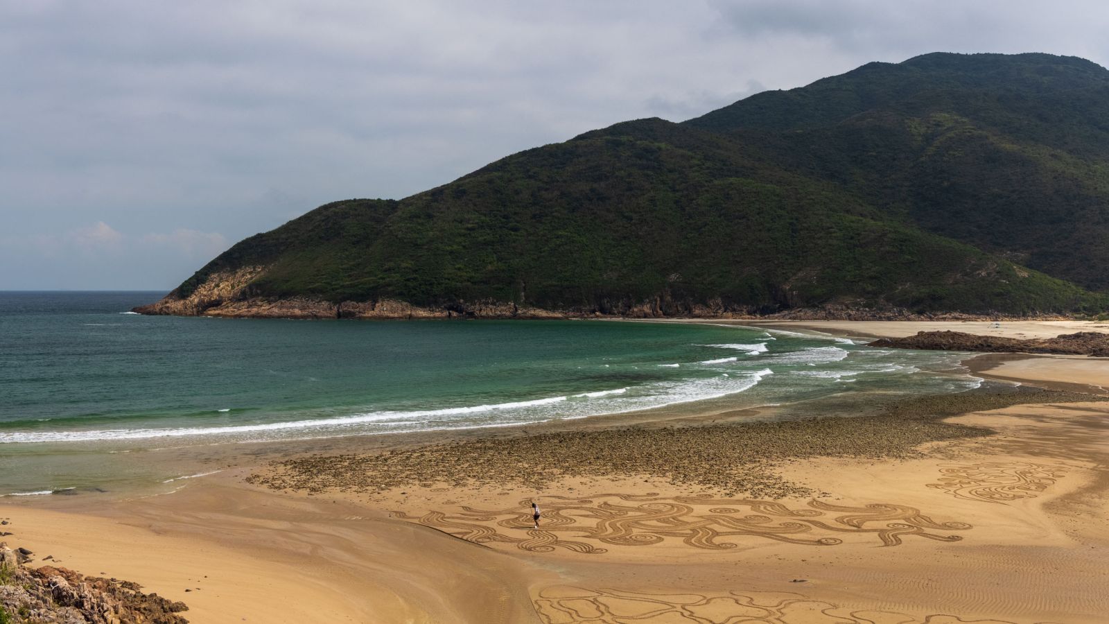 A small headland dividing the beach into 2 section