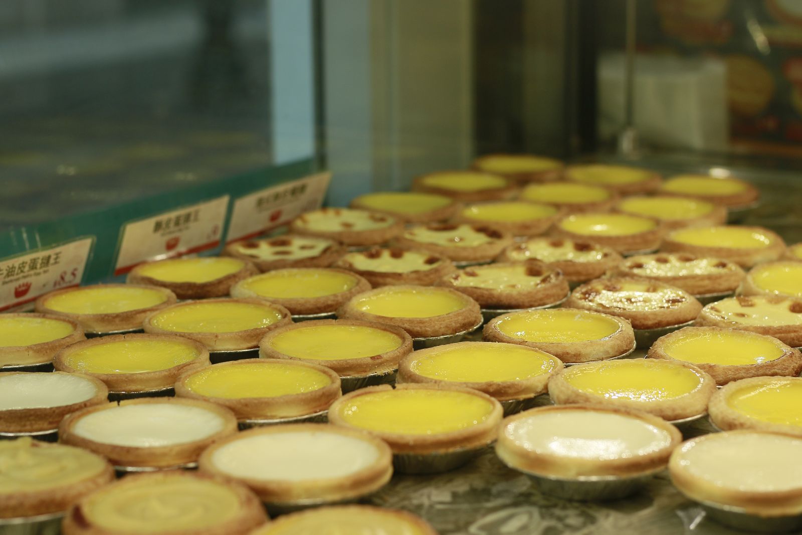 Different flavours of egg tarts