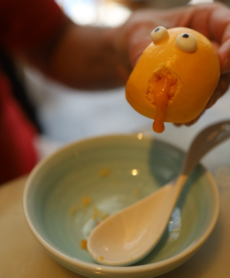 A playful way to enjoy your Hot Custard Molten Bun (睇住流奶)